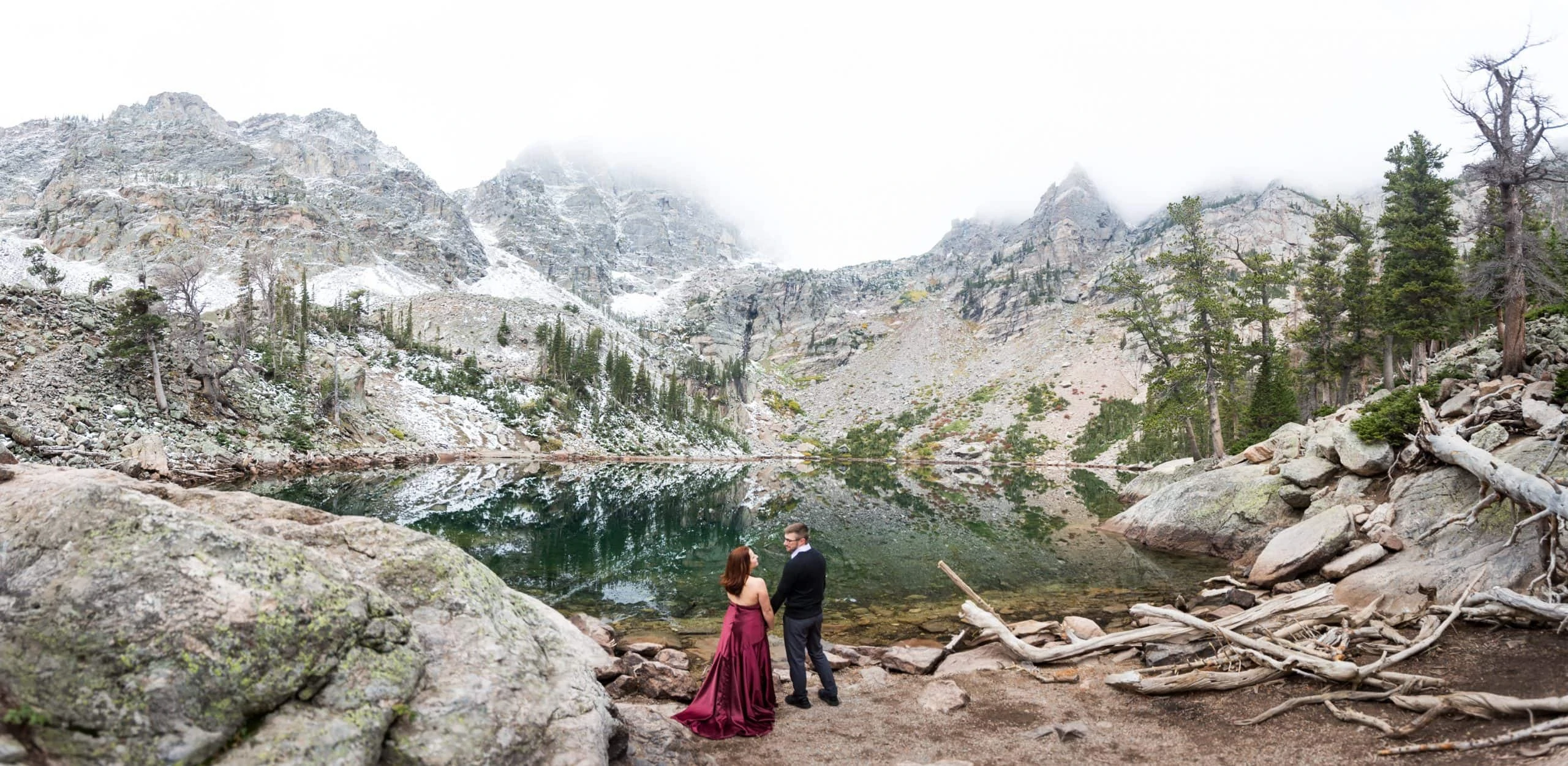 An engagement photo at emerald lake in Rocky Mountain National Park.