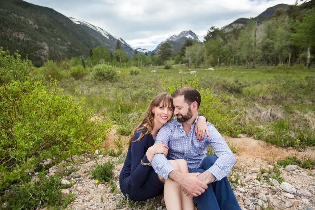 An engagement photo with a mountain view in rocky mountain national park.