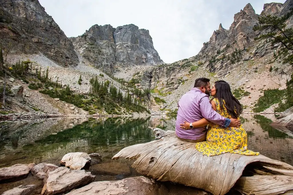 A couple smooches for their rocky mountain national park engagement photographer.