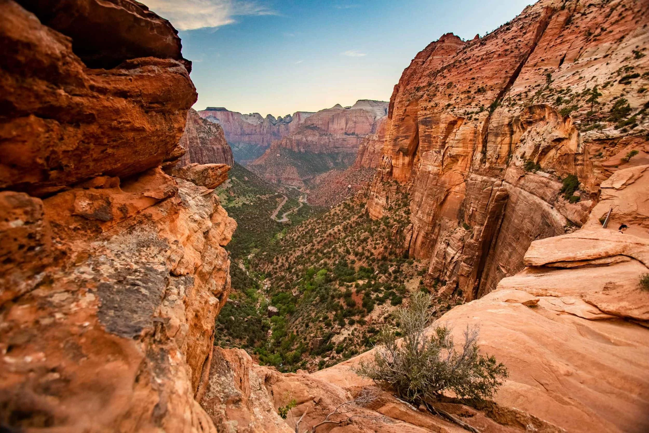The Canyon overlook in zion national park is a colorful vista surrounded by massive red stone mountains.