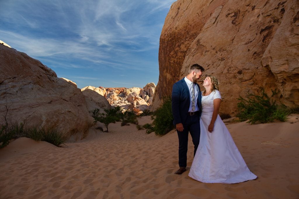 An elopement couple poses for a photo inside valley of fire park.