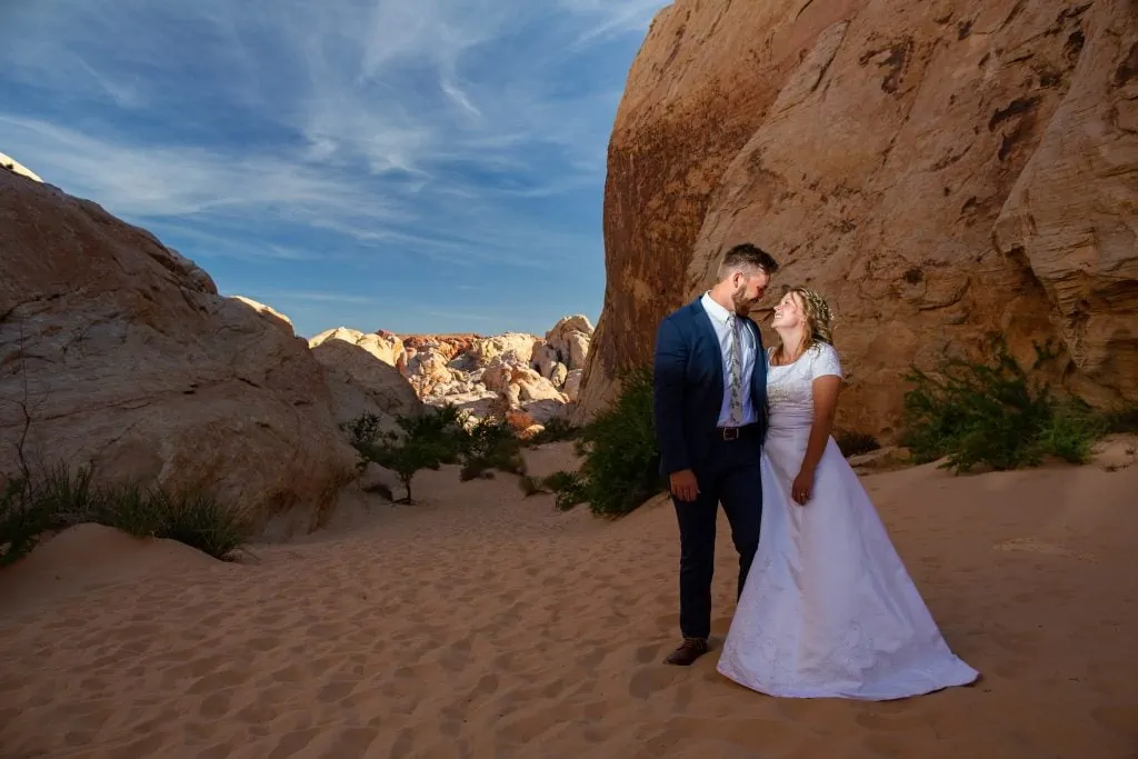An elopement couple poses for a photo inside valley of fire state park.