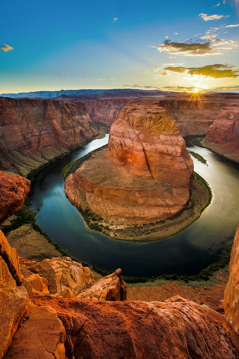 Horseshoe bend at sunset makes a colorful elopement location in Arizona.