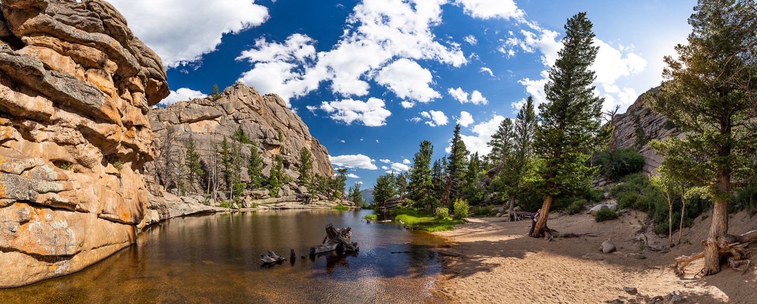 A panorama of Gem Lake in Rocky Mountain National Park in July.
