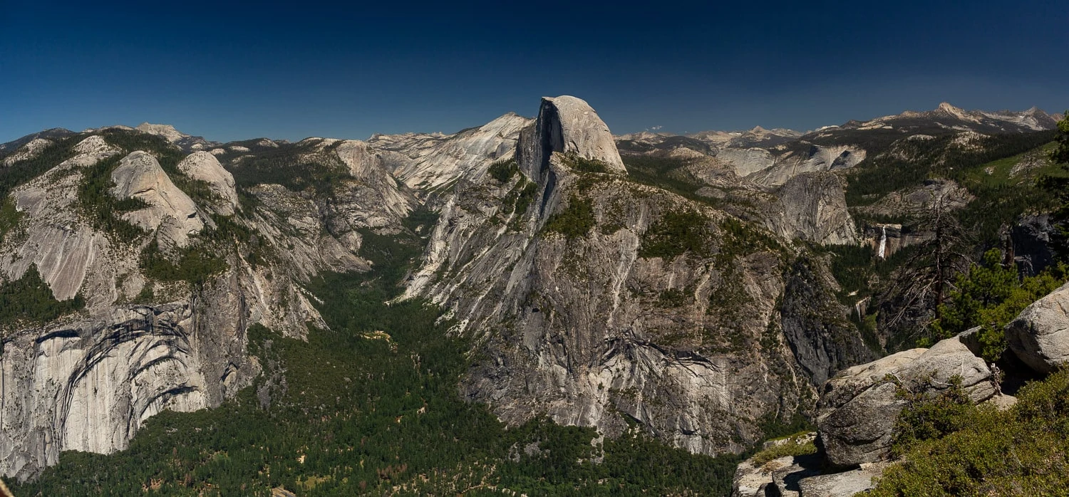 A summer panorama of half dome by Yosemite elopement photographer Lucy Schultz.