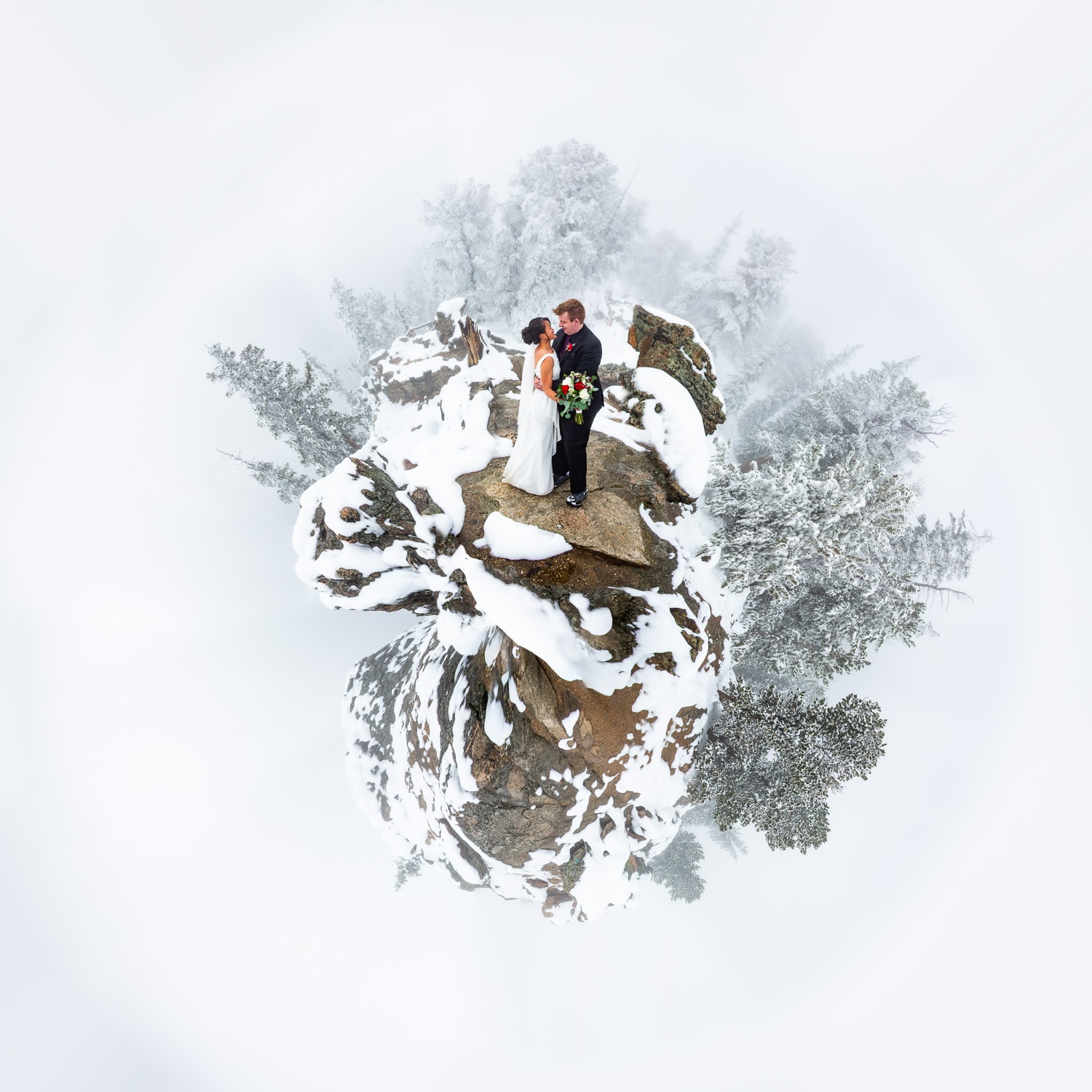 A photo effect shows a tiny planet of a winter wedding couple in the mountains.