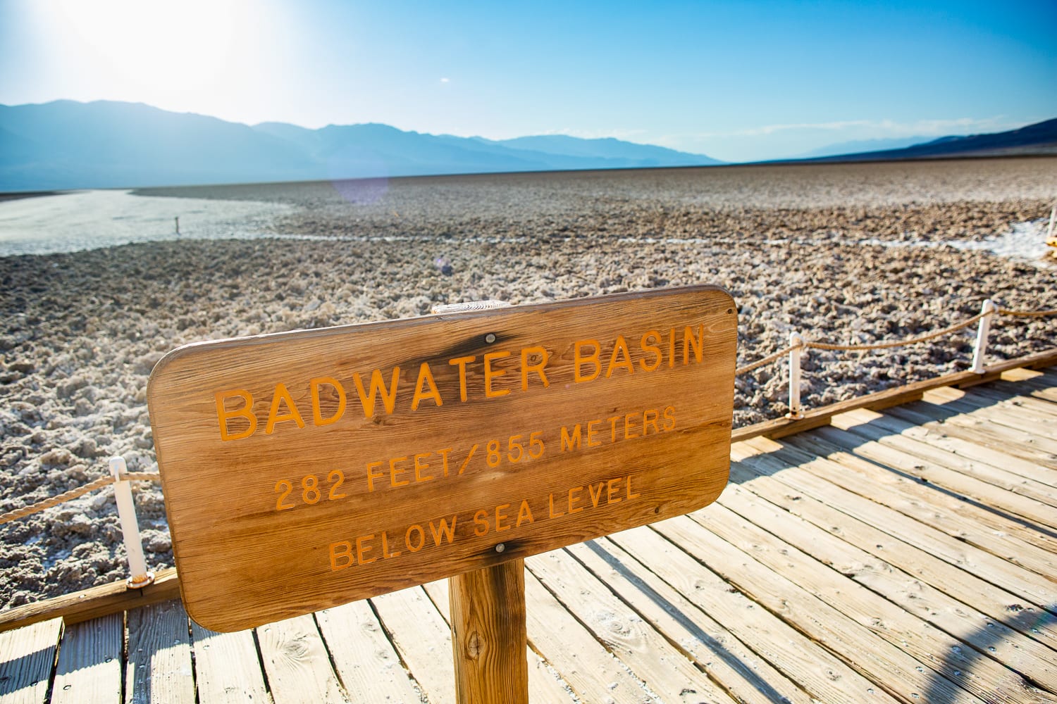 A wooden sign at badwater basin salt flats shows the elevation.