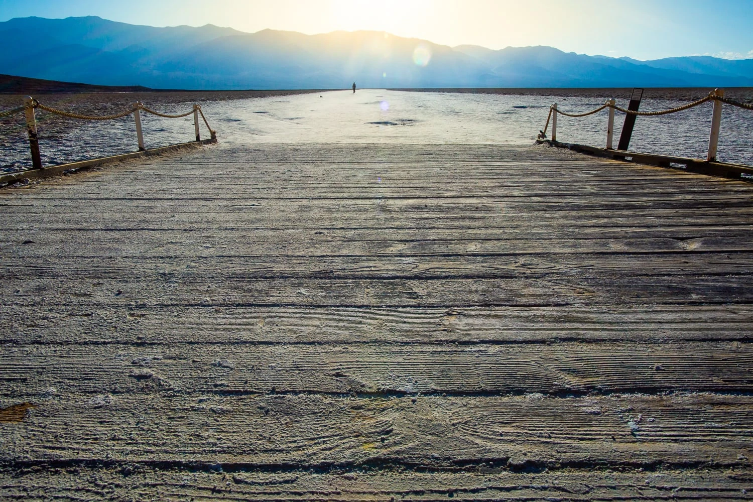 The end of a boardwalk gives way to the saltwater flats at Badwater basin.