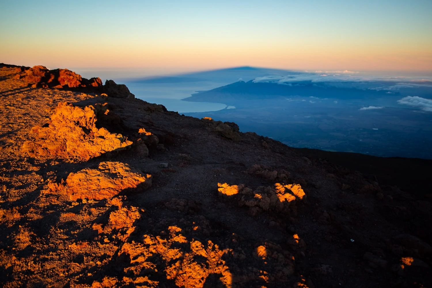 Haleakala elopement photographer Lucy Schultz showcases the sunrise light at the summit of Maui's volcano.