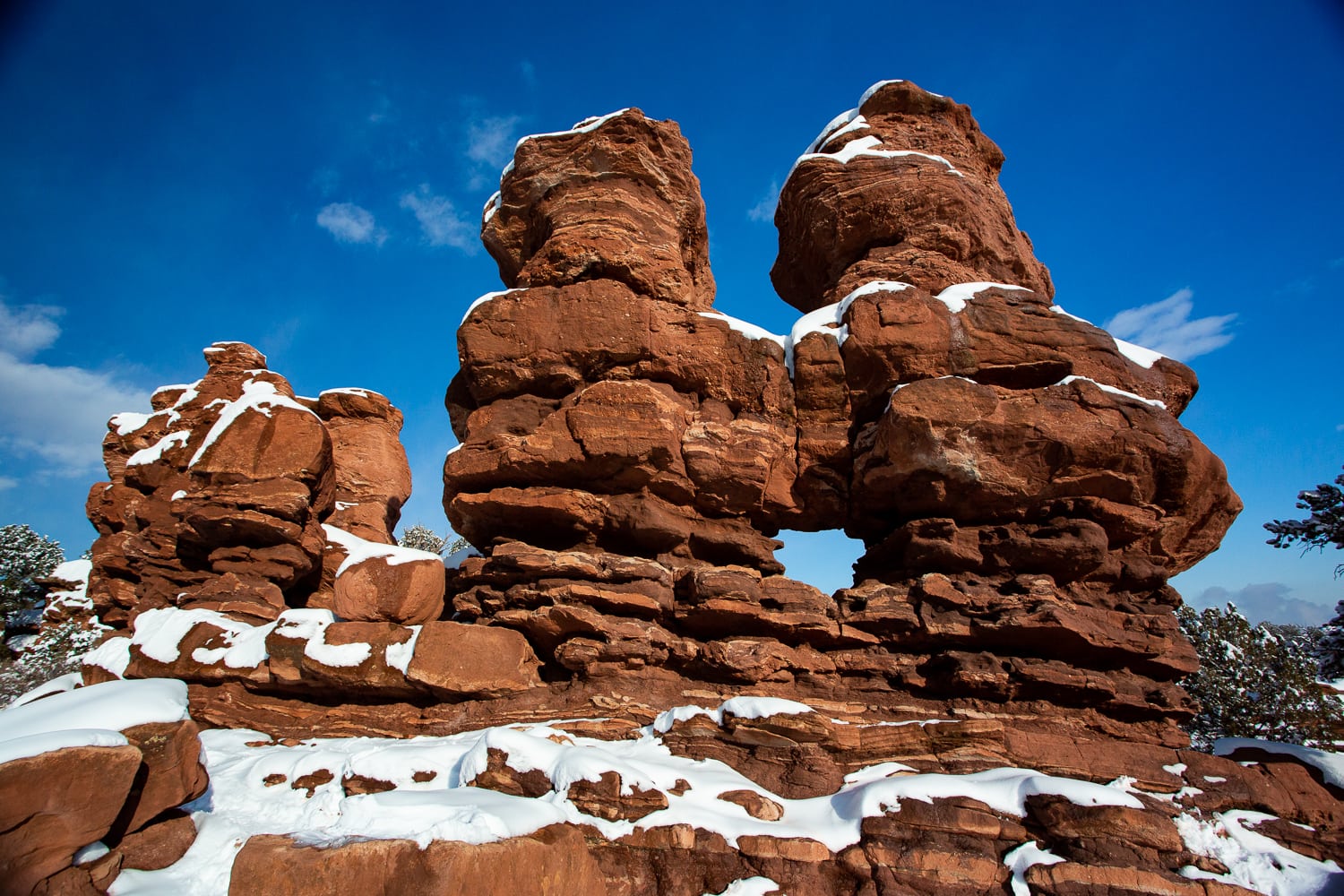 Snow on the siamese twins rock formations at Garden of the Gods.