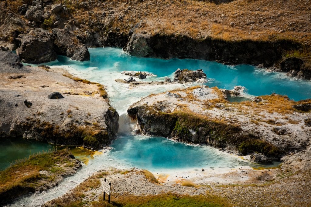 Turquoise pools release steam from Hot Creek in California.