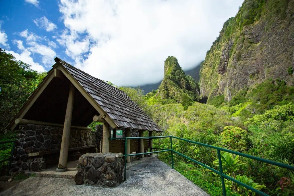 A picnic table shelter in I'ao valley overlooking the famous stone monument in Maui.