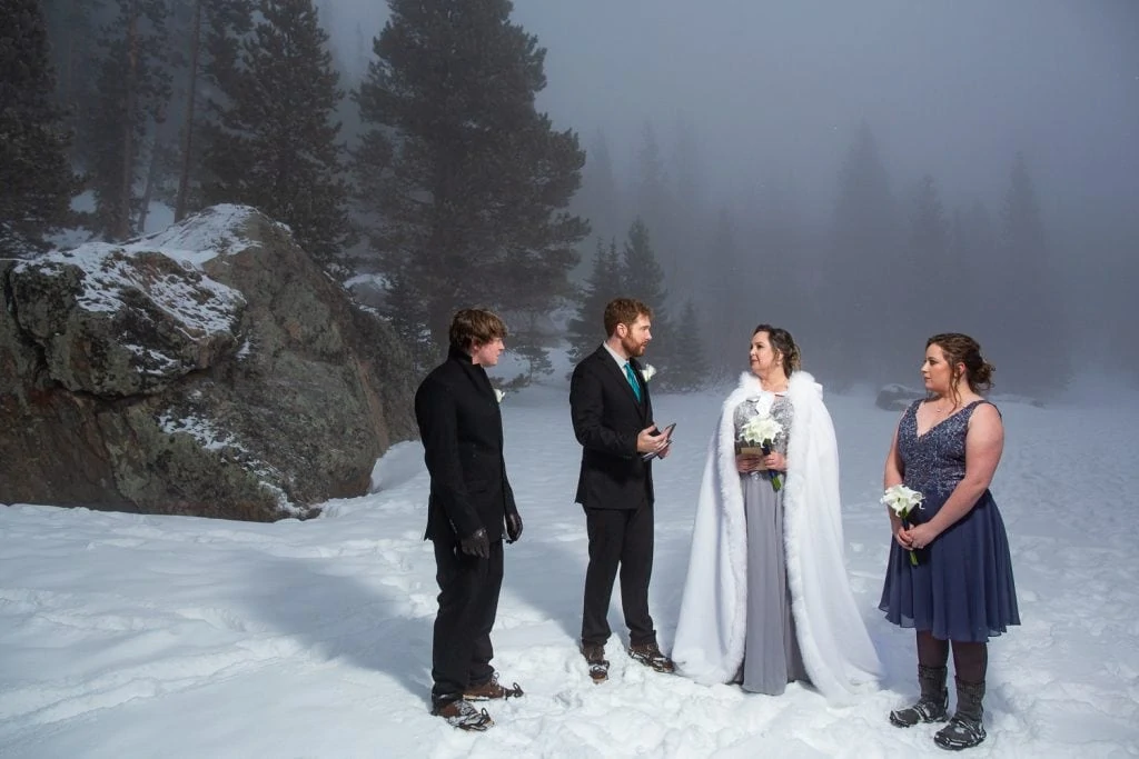 an elopement ceremony on a frozen lake in winter.