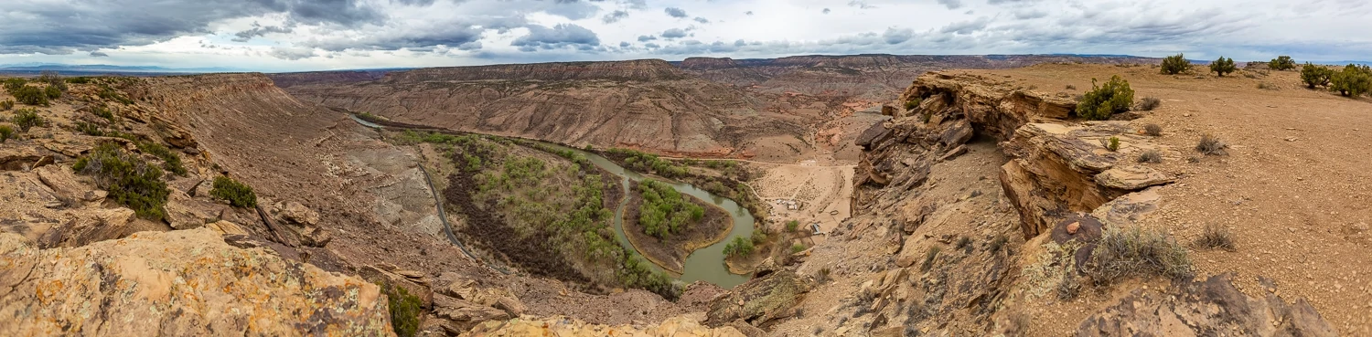 A panorama of a canyon with a river far below.