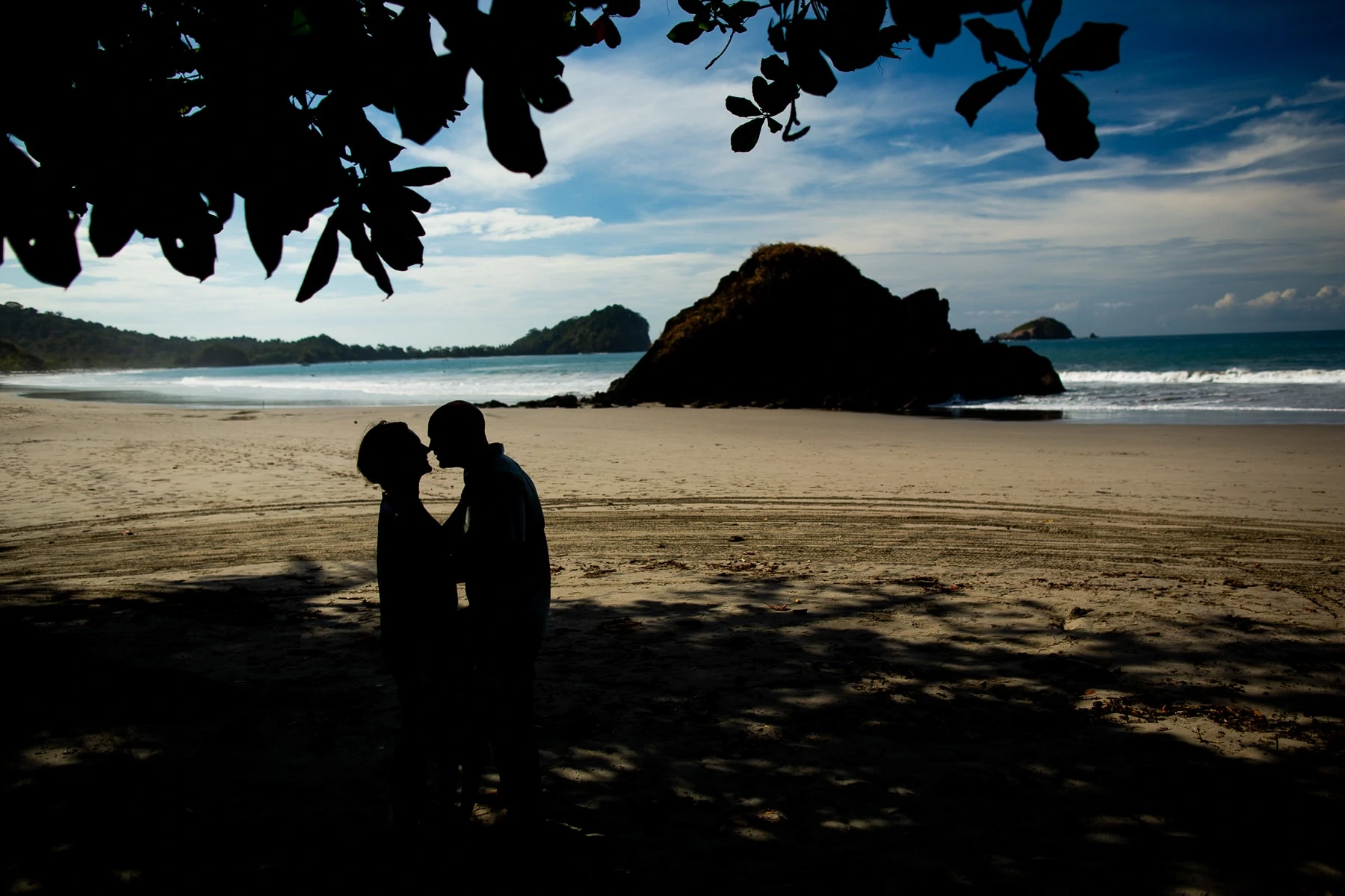An elopement couple's silhouettes at the beach in Manuel Antonio, Costa Rica.