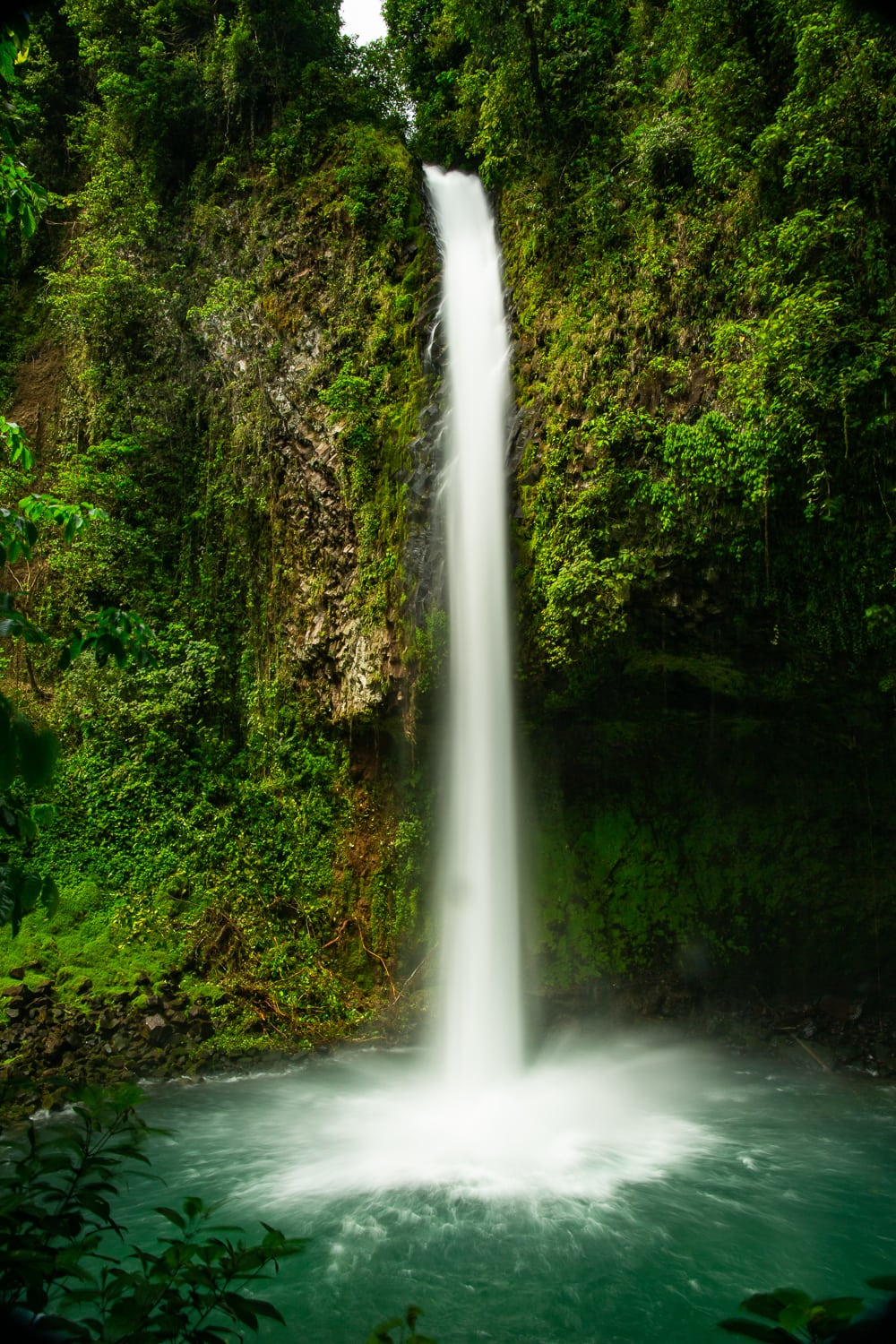 A slow motion photo of La Fortuna falls taken from the viewing platform.