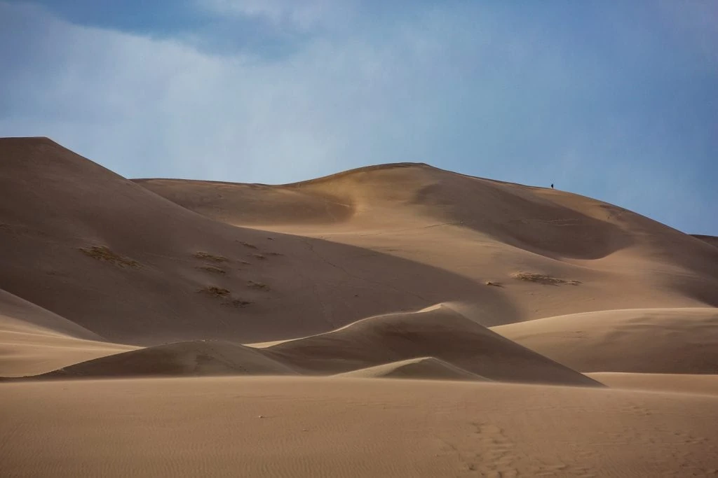 Wind sweeps over the sand dunes in Colorado.