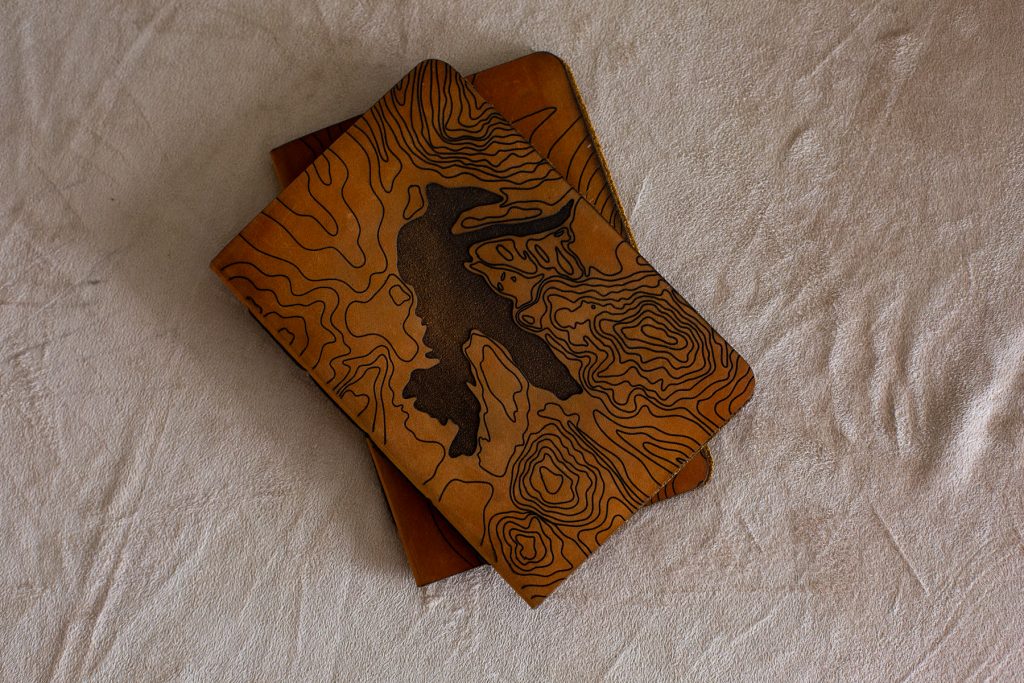 Handcrafted leather vow books for writing your elopement vows in.