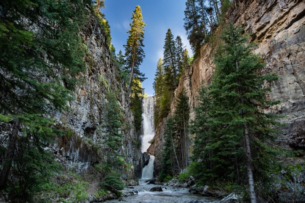 A secret waterfall in a steep canyon in telluride, Colorado in June