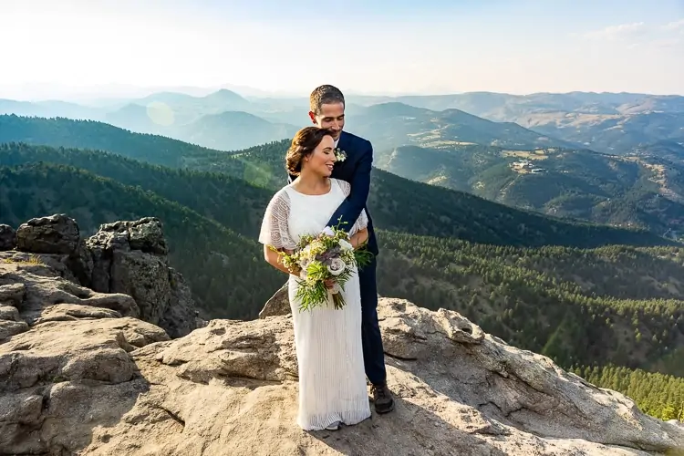 An elopement couple embrace at Lost Gulch Overlook in Colorado.