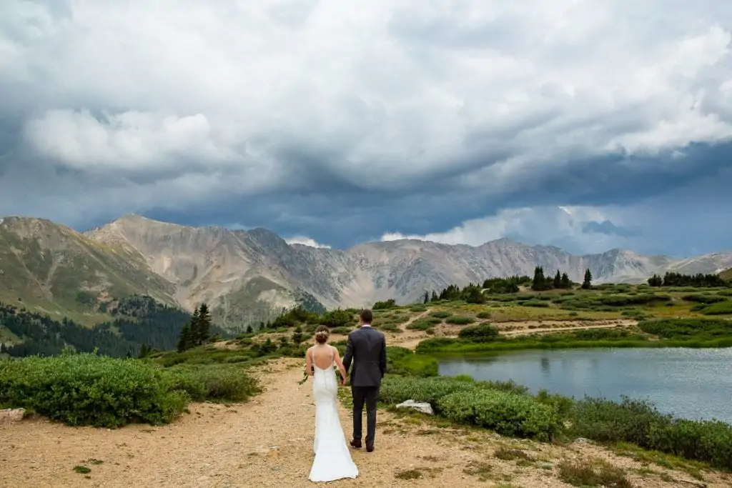 A recently married elopement couple at loveland Pass lake