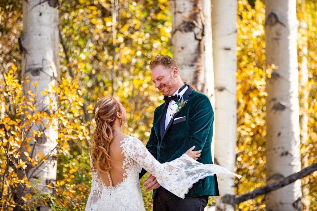 A bride and groom's first look in an Aspen grove during their Elopement in Colorado.