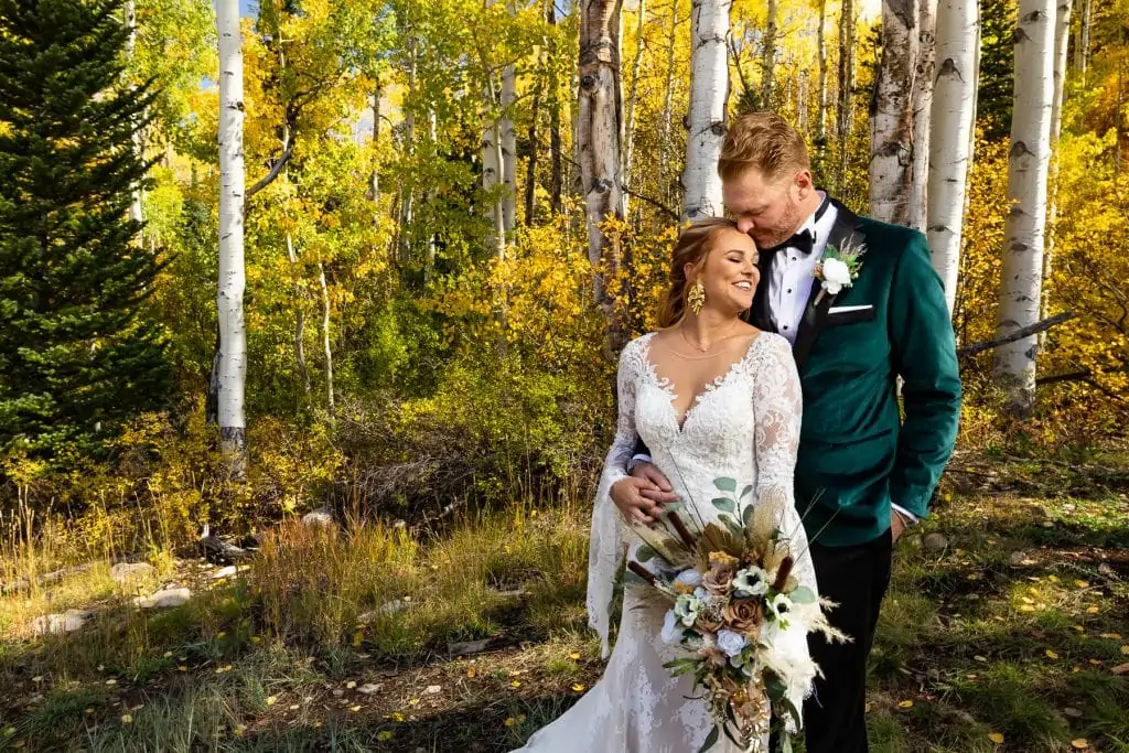 A portrait of a bride and groom in an aspen forest eloping in Colorado.