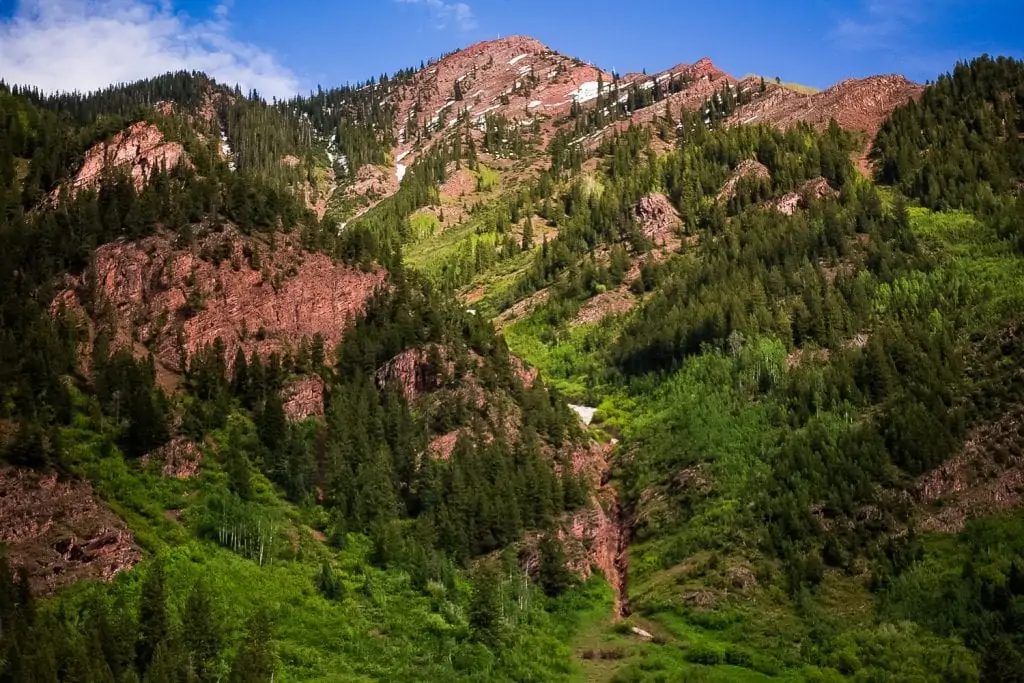 A red mountainside elopement location in Aspen, Colorado in June.