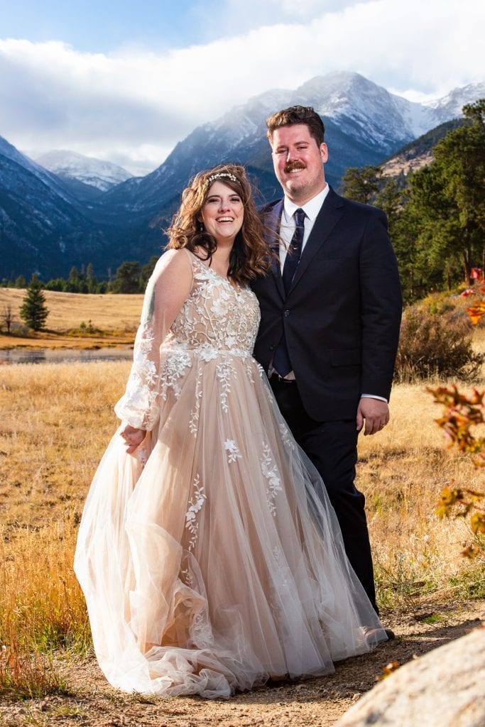 A couple smiles in rocky mountain national park after their elopement.