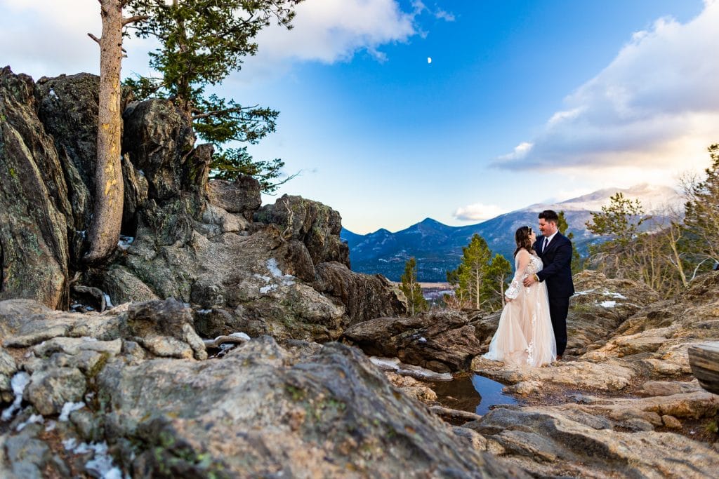 An elopement couple smooches in rocky mountain national park near Estes Park, colorado. 