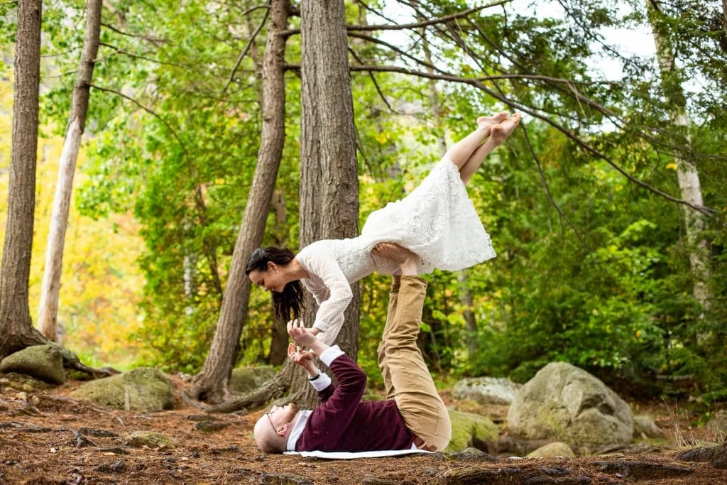 A couple does acro yoga durig their elopement.