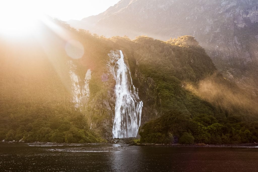 Bowen Falls at sunrise in Milford Sound, New Zealand.