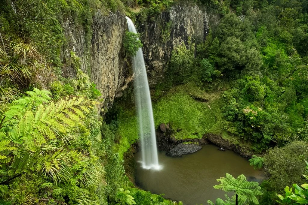 Bridal veil falls in New Zealand drops 70 feet into a round pool.