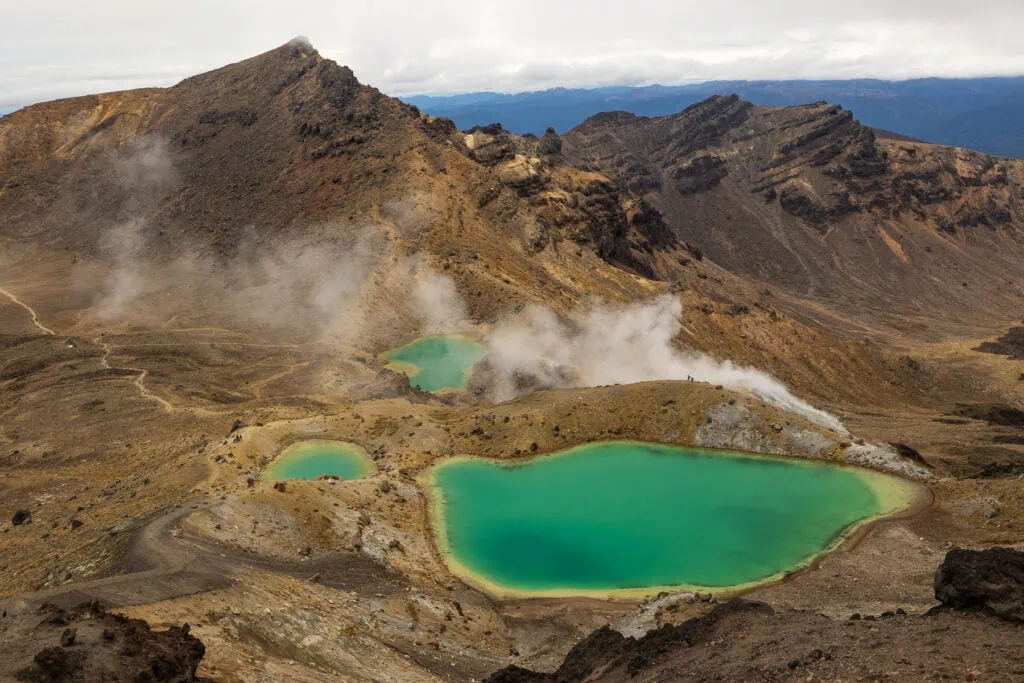 The turquoise lakes on the Tongariro Alpine Crossing hike on New Zealand's North Island give off steam.