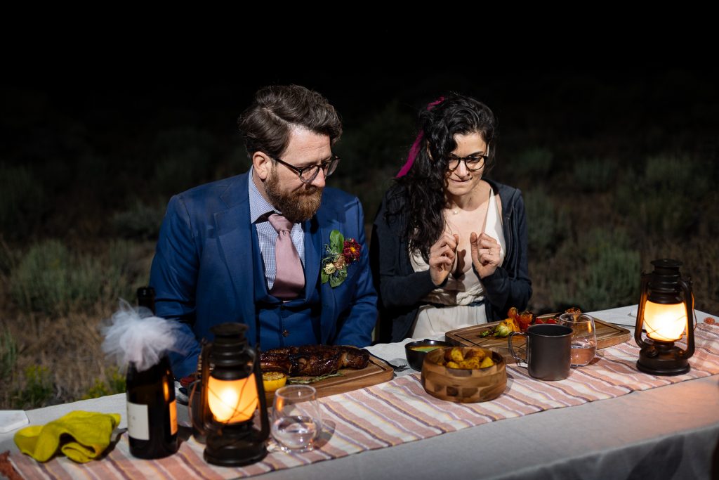 An elopement couple saves money by hiring a private chef for their dinner in a remote area.