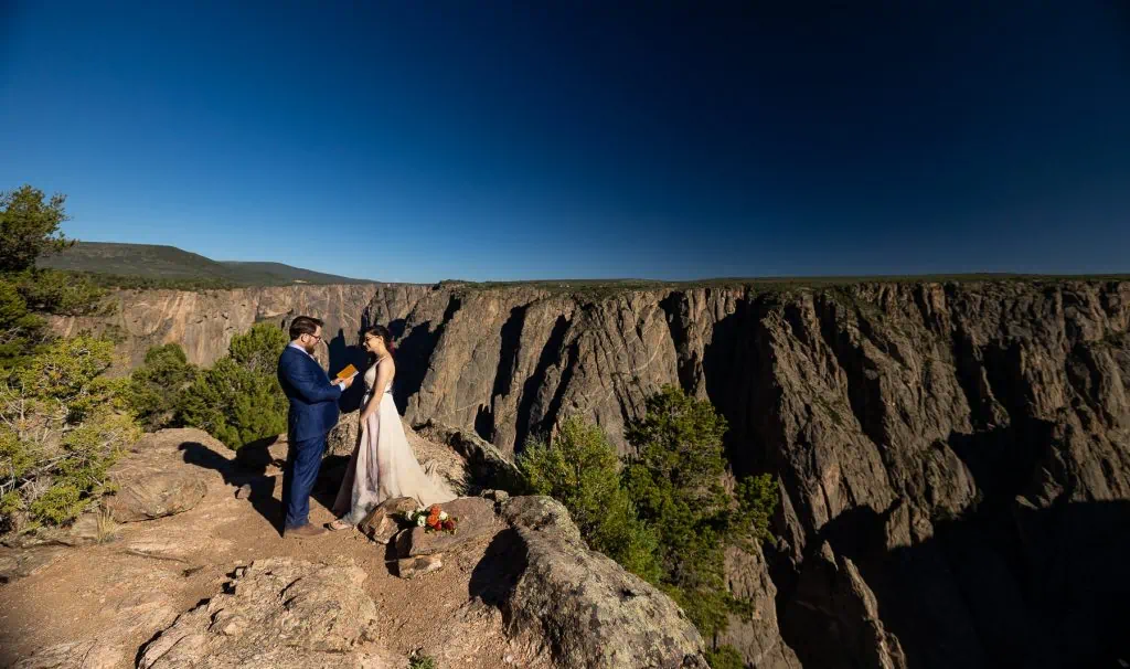 A hiking elopement couple says their vows at exclamation point.
