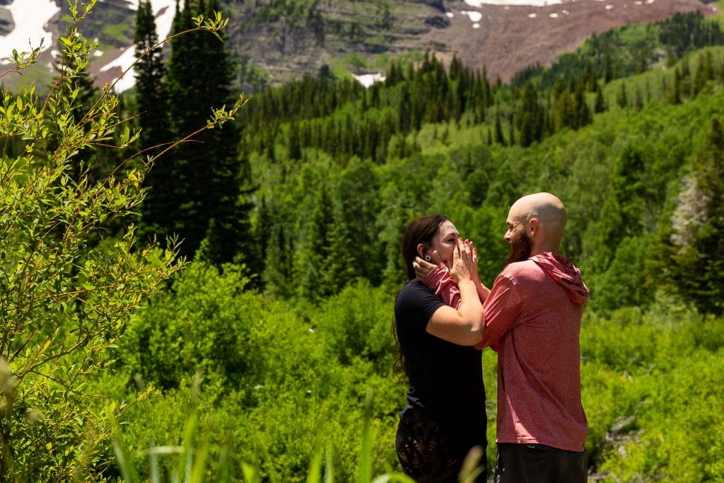 A woman is emotional after being proposed to in Aspen, Colorado.