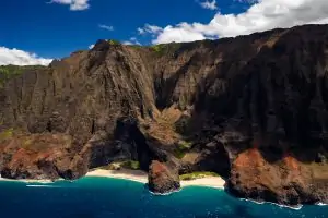 The Na Pali coast of Kauai is photographed in full color by Kauai Elopement Photographer Lucy Schultz.