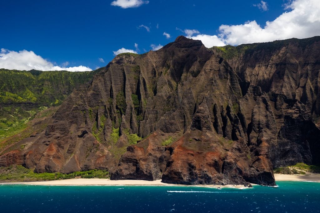 The colorful Na Pali coastline of Kauai's west shore taken from a helicopter.