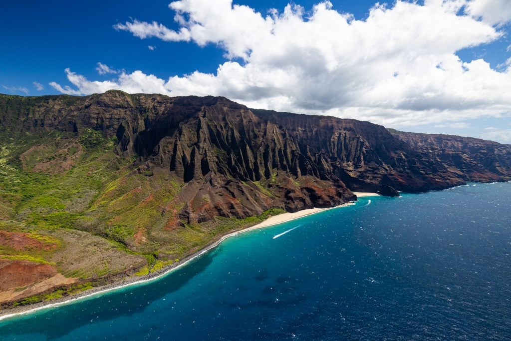 The colorful na pali coastline of Kauai is rugged and remote.