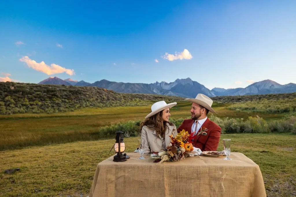 The elopement couple's dinner in a mountain valley destination at sunset.