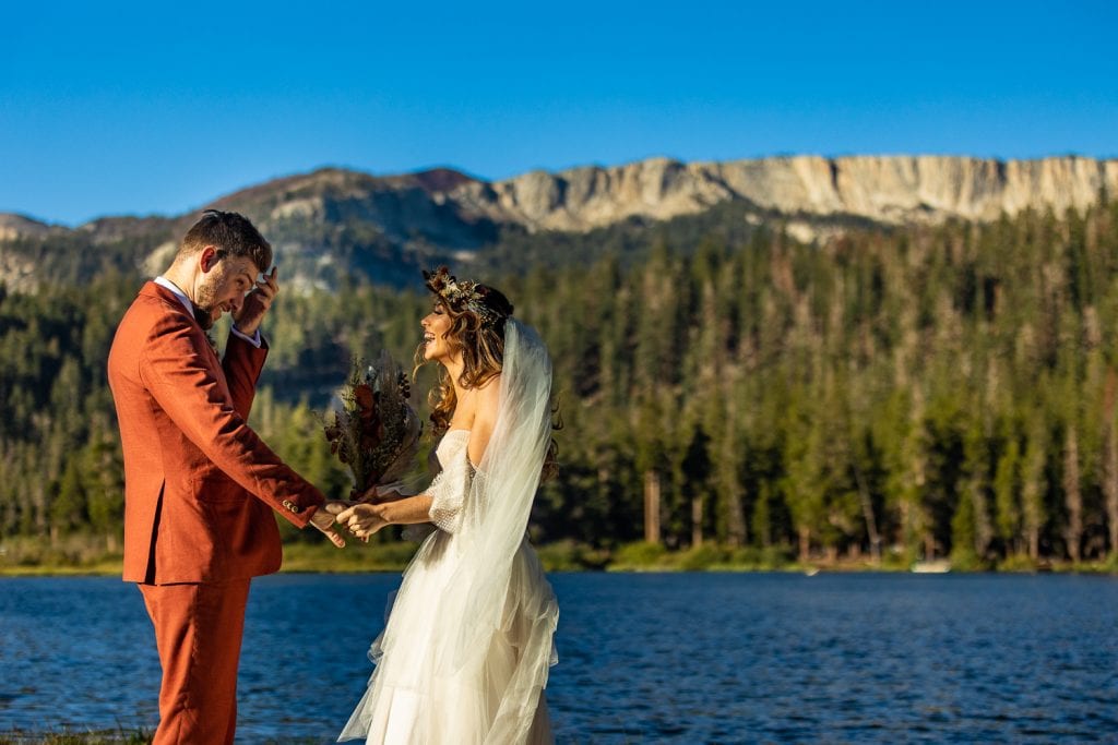 An elopement couple first look at Twin Lakes in Mammoth Lakes, California.