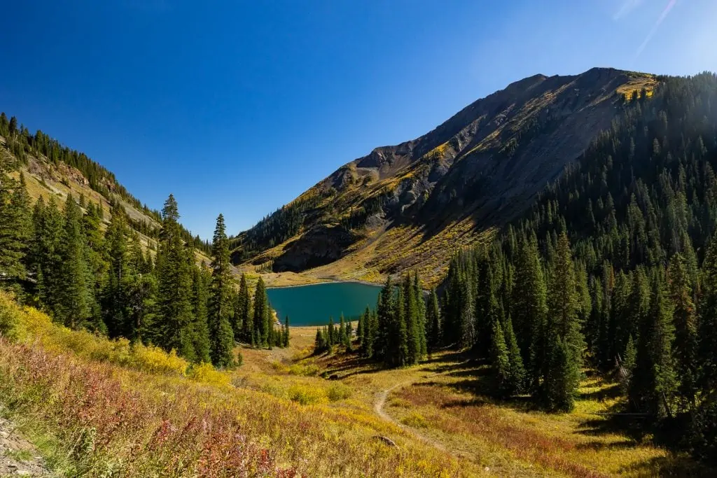 Emerald lake is a popular place to elope in Crested Butte because of its beautiful color.