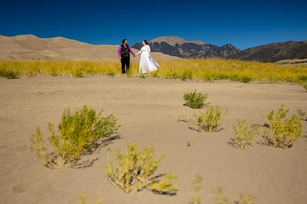 A wedding photo at great sand dunes national park in October.