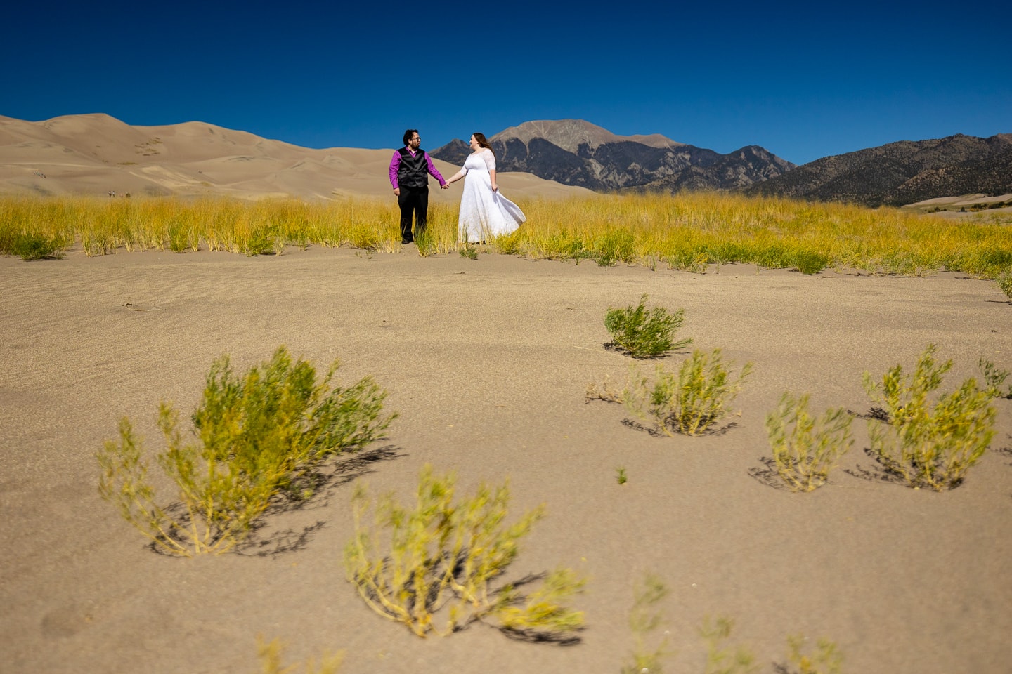 A wedding photo at great sand dunes national park in October.