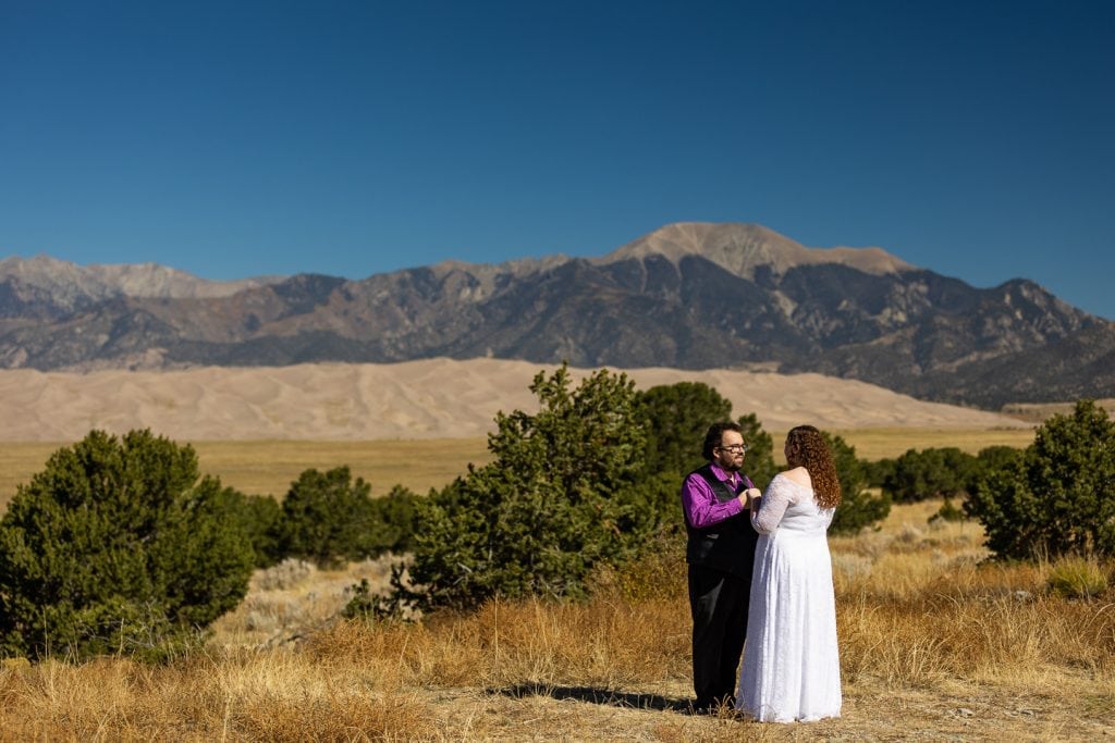 A bride and groom's first look at the great sand dunes lodge. 
