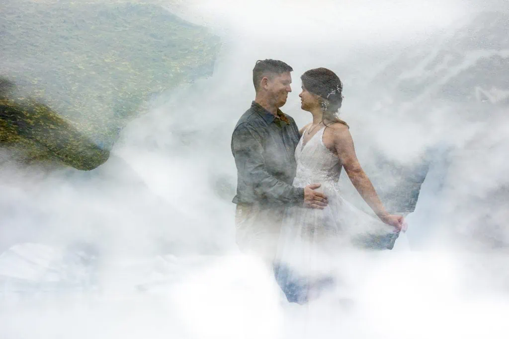 A double exposure of an elopement couple in the misty mountains of New Zealand. 