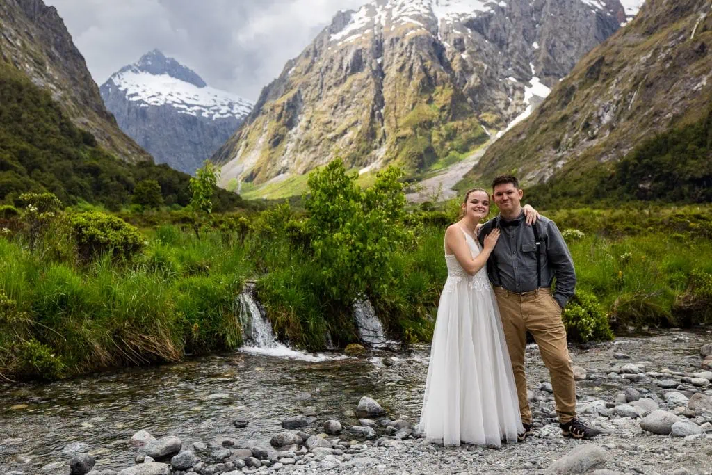 A wedding couple at Monkey Creek in Fjordland National Park.