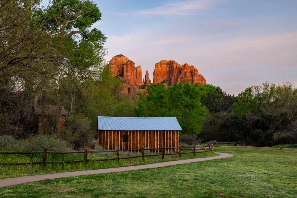 Sunset colors touch Cathedral Rock in Crescent Moon Ranch park in Sedona.