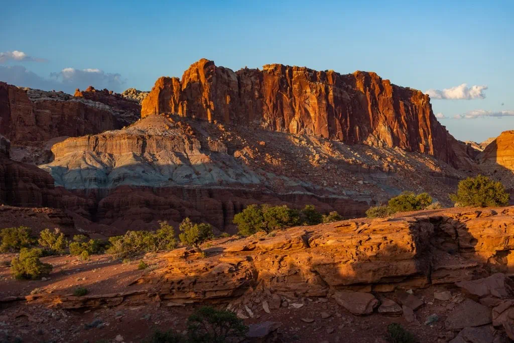 Capitol Reef National Park is known for the Waterpocket Fold, a folded rock formation that forms towering red cliffs in southern Utah.
